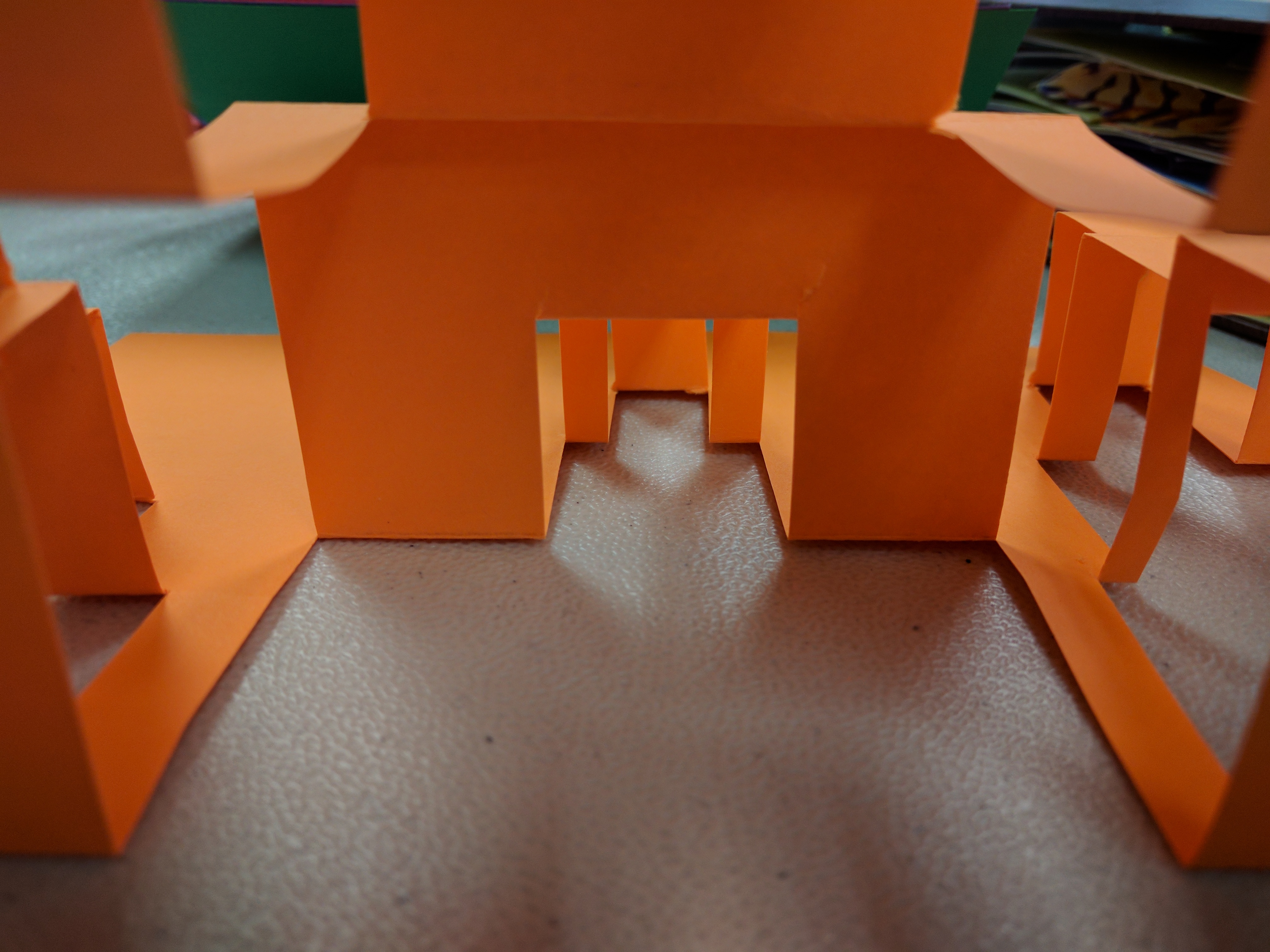 2D student artifact: photography series of paper popups and architectural shadows